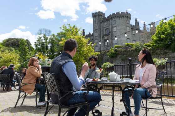 people socialising in Kilkenny on a coach trip from Scotland to Ireland