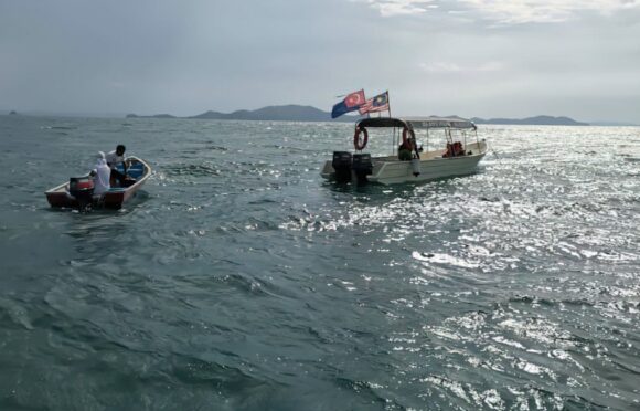 Search and rescue boats look for the missing divers off the coast of Mersing in Malaysia yesterday