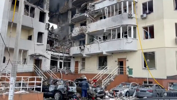 Rescue workers survey the apartment block in Odesa hit by a rocket yesterday, killing at least eight people, including a baby