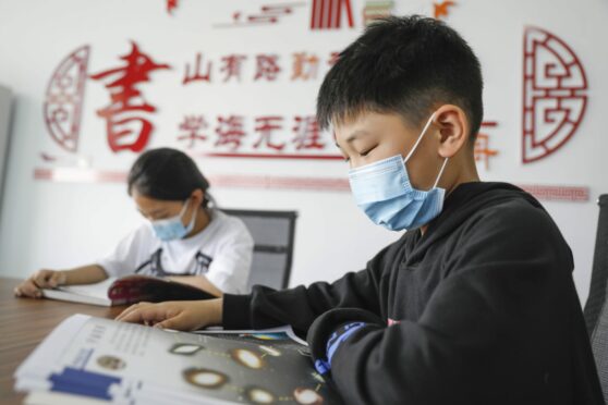 Children in China’s Henan province on World Book Day last month