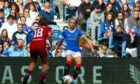 Rangers’ Brogan Hay on the ball against Aberdeen’s Eva Thomson in April as the Ibrox side strode towards a first title