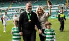 Celtic manager Ange Postecoglou celebrates the title win with his family