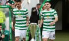 Departing players Nir Bitton and Tom Rogic bring out the trophy