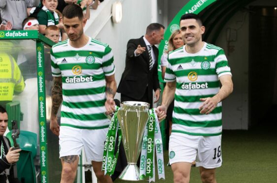 Departing players Nir Bitton and Tom Rogic bring out the trophy