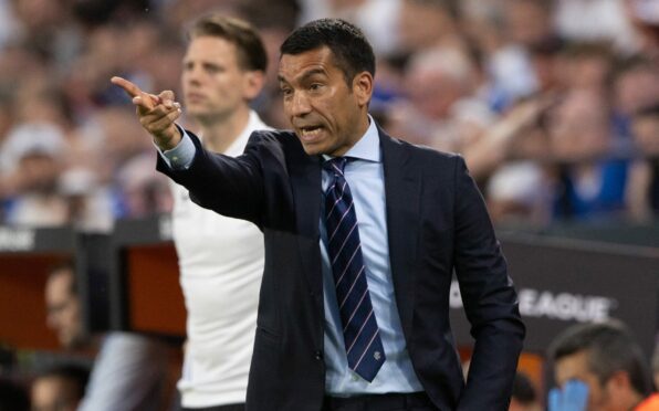 Giovanni Van Bronckhorst on the touchline in Seville