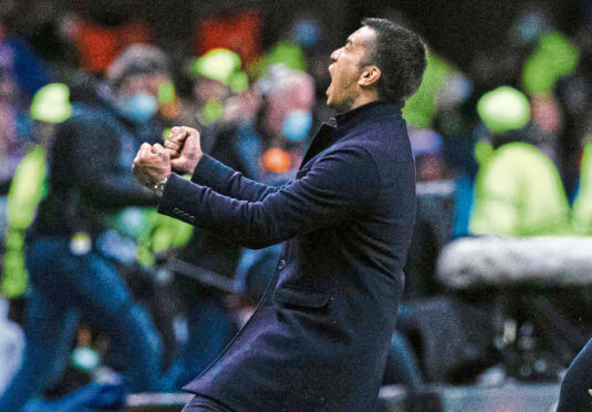 Giovanni van Bronckhorst enjoys the moment after Rangers’ win over RB Leipzig.