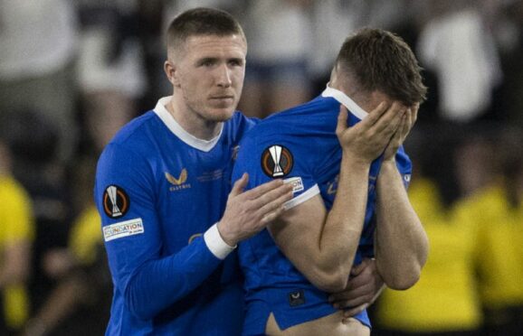 Aaron Ramsey was comforted by John Lundstram following his crucial missed spot-kick in Seville