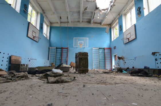 Basketball hoops and climbing frames remain but the school gym hall in Sorokivka is in ruins after being used as a base by both Russians and the Ukrainians troops