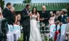Lucy is walked down the aisle at Inchberry Hall by her father Robert, left, and Tommy’s dad Tony, right