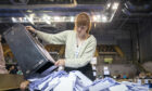 Ballot boxes are opened ready for sorting at the Glasgow City Council election count at the Emirates Arena