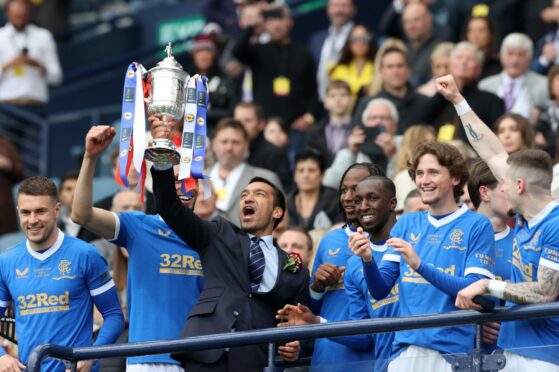 Rangers manager Giovanni van Bronckhorst lifts the Scottish Cup