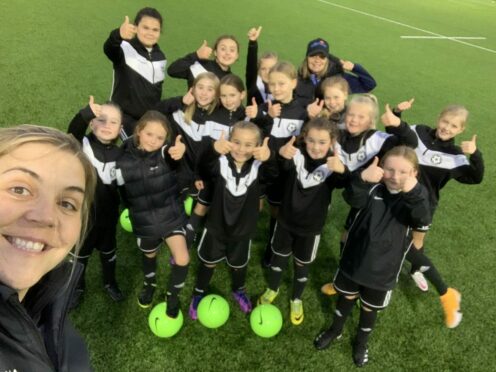 Cumnock Juniors Girls’ coach Mhari Lindsay with her players at training