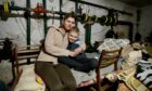 Yulia and her son Misha, eight, in their makeshift home in the basement of an apartment building in Kharkiv, Ukraine.