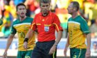 Craig Moore pleads with referee, Roberto Rosetti, not to send off Harry Kewell during a match against Ghana at the 2010 World Cup Finals, but it fell on deaf ears