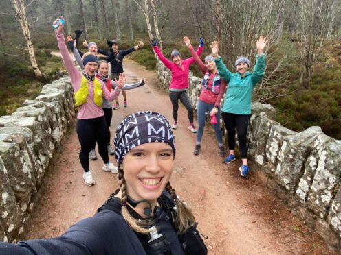 Emma Petrie and Fay Cunningham, in yellow, celebrate the record with friends at Glen Tanar in Aboyne