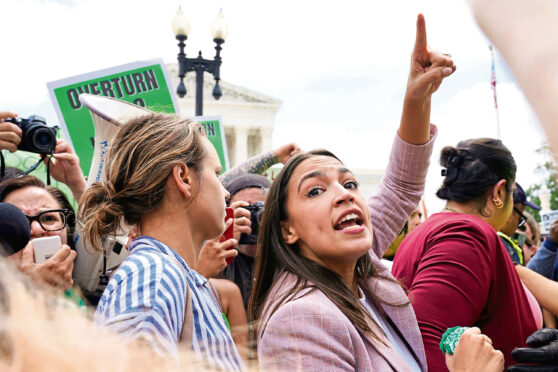 Rep. Alexandria Ocasio-Cortez, D-N.Y., joins abortion-rights activists as they demonstrate following Supreme Court's decision to overturn Roe v. Wade in Washington.