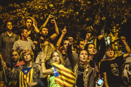 Catalan separatists shout slogans as they protest in front of the Catalan Economy Ministry in Barcelona in 2017.