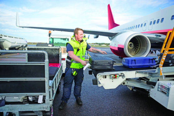 A baggage handler at work