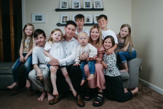 The King family, left to right, Emily, six, Lucas, 13, Poppy, three, dad Daniel, Robbie, 14, Corey, two, mum Aimee, Kerr, 11, Sofia, eight, and Eilidh, nine at home in Edinburgh