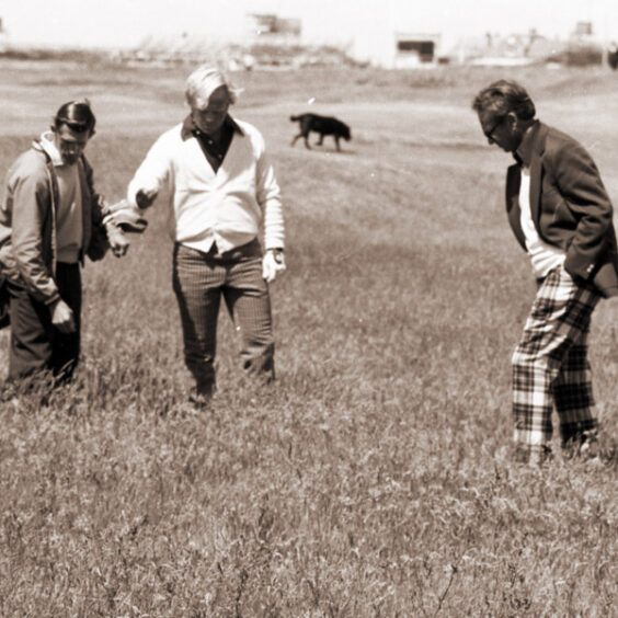 Jack Nicklaus (centre) pictured during practice day at Troon searching for his ball in the long rough, 1973.