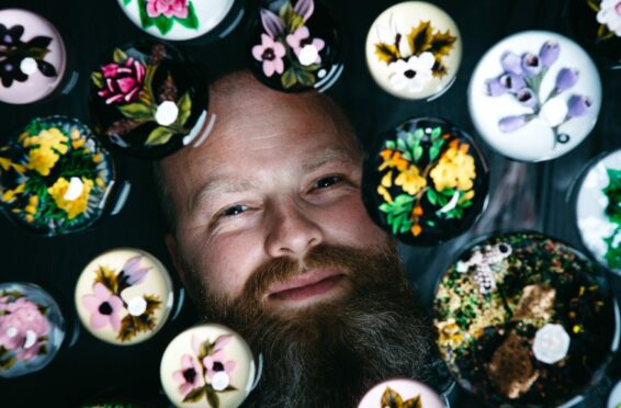 Glassmaker William Manson with his paperweights