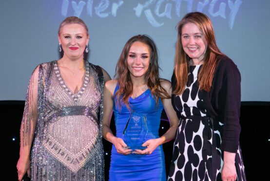 Tyler Rattray, winning The Val McDermid Award, along with Jane Dougall and Aileen Campbell (Pic: Andrew Cawley)