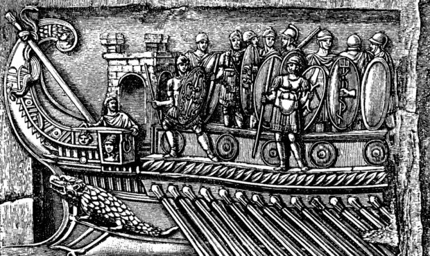An engraving shows the prow of a Roman warship, the kind used to invade Britain