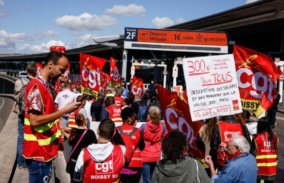 Striking airport workers demonstrate at Charles de Gaulle Airport in Paris last week.