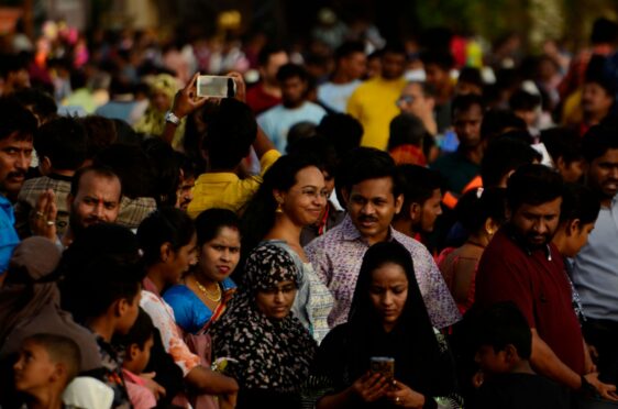 Huge crowds gather near Juhu beach, closed because of high tides, in Mumbai last week