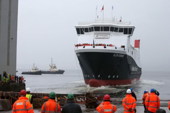 The Glen Sannox ferry, with windows painted on, is launched by Nicola Sturgeon in a ceremony that should not have taken place, according to chairman of CalMac, formerly of CMAL, Erik Østergaard