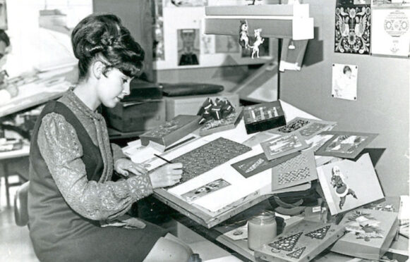 An artist working for postcard publishers Valentine & Sons, the focus of a V&A Dundee exhibition, in 1971.