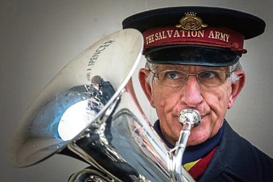 Roger Bromage plays the euphonium as the Salvation Army band plays in Dundee in 2019.            (Pic: Mhairi Edwards)