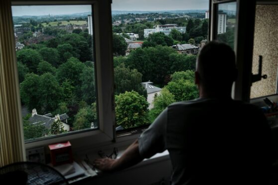 From his 17th floor flat, a resident looks over the leafy enclave in Paisley where Liz Truss once lived.