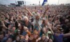 Music fans cheer on their favourites at T in the Park in July 2011