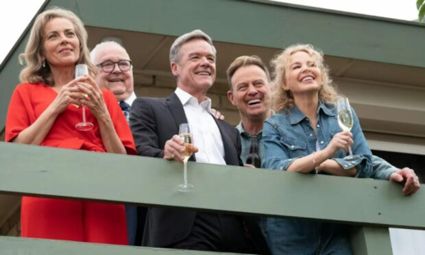 Stefan Dennis, centre, is reunited with Neighbours castmates for the soap’s finale, from left: Annie Jones, Ian Smith, Jason Donovan and Kylie Minogue