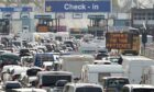 Drivers wait in long queues at Dover yesterday on one of the port’s busiest weekends of the year as tighter checks in France are blamed for delays and blamed on UK’s EU exit