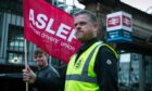 Members of ASLEF train driver's union forming a picket line at the entrance to Edinburgh Waverley station, as train strikes took place the country.