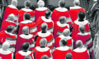Peers wearing their parliamentary robes attend the state opening of Parliament at Westminster.