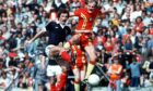 Graeme Souness and Wales’ Terry Yorath attempt to leave their mark during a Home International in 1979
