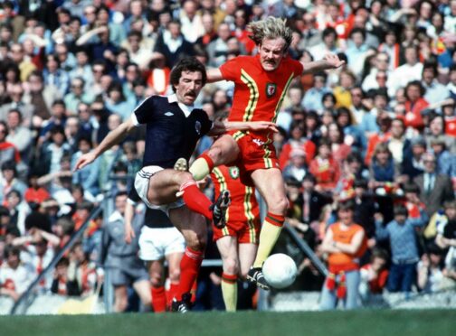 Graeme Souness and Wales’ Terry Yorath attempt to leave their mark during a Home International in 1979