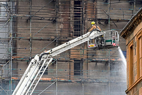 Firefighters the morning after 2018 blaze