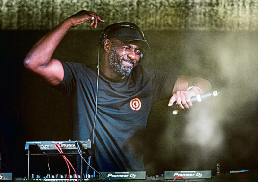 Idris Elba on the decks at Groove Loch Ness in 2018