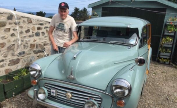 Alan McPherson with his 1969 Morris Traveller at home in Cullen
