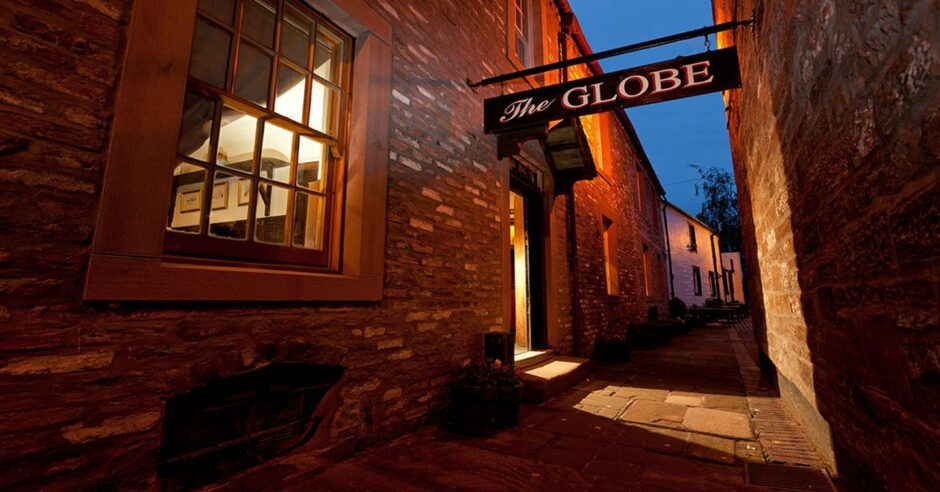 the nondescript facade of the Globe Inn belies the treasures inside when you visit Dumfries and Galloway