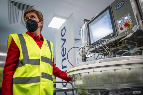Nicola Sturgeon operates a cell expansion bioreactor during a 
visit to the Valneva plant in Livingston in March.