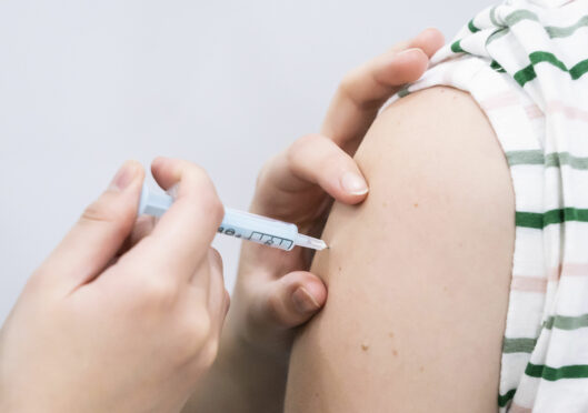 A coronavirus vaccine being administered