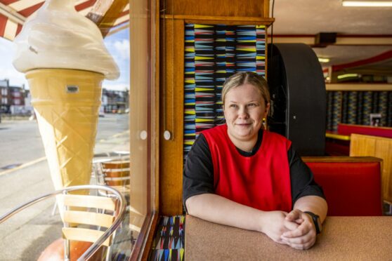 Amy Joyce, manager of The Ritz Cafe in Millport on Cumbrae, looks out at a busy shore last week