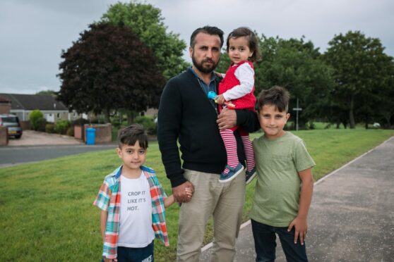 Omid Asak, with his children, Ahmad, Jebran and Maryiam