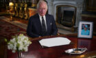 King Charles III delivers his address to the nation and the Commonwealth from Buckingham Palace
