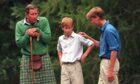 Charles with sons Harry and William at Balmoral in 1997